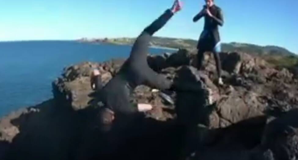 Stills from footage taken by Sydney teens' whose dangerous stunt at Kiama Blowhole sparked an emergency services rescue operation. Picture: Seven News