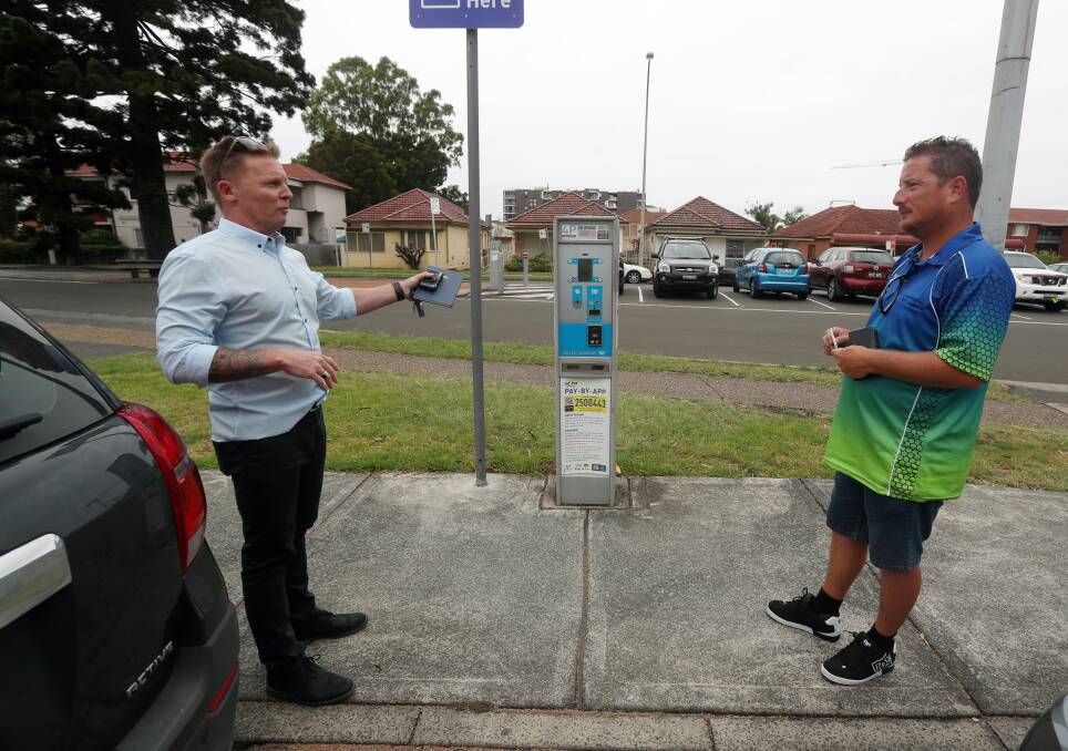 'Unfair': A senior parking ranger from Wollongong City Council talked with Mr Lewis after he made a complaint to the council on Thursday. Mr Lewis' partner was issued with a fine when the meter was broken. Picture: Robert Peet