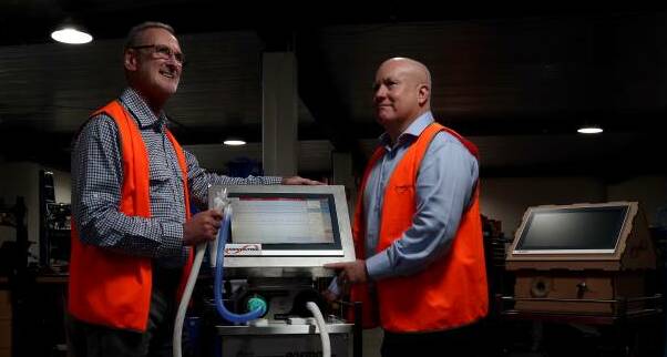 Innovation at work: From left, Ampcontrol product and development manager Chris Bird, Ampcontrol Group Manager in Engineering, Dr Ian Webster and Ampcontrol CEO Rod Henderson with the advanced prototype ventilator. Picture: Simone De Peak