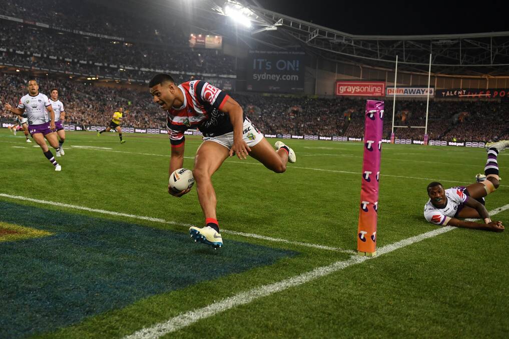 SHUT THE GATE: Roosters winger Daniel Tupou beats Melbourne's Suliasi Vunivalu to score the opening try of the 2018 NRL grand final. Tupou crossed the line in each of his team's three play-off victories. Picture: Dean Lewins, AAP