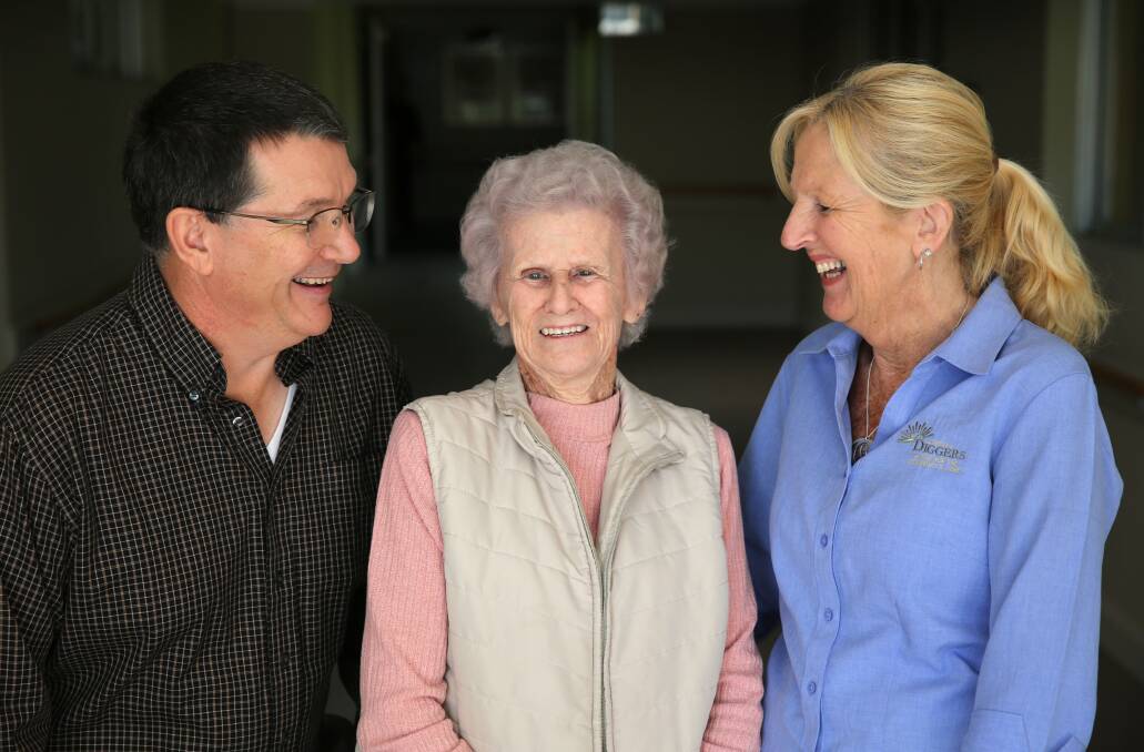 Rewarding: Illawarra Diggers Aged and Community Care volunteer carers Matthew Douglas and Maree Bishop spend time with resident Joyce Ingram (centre).