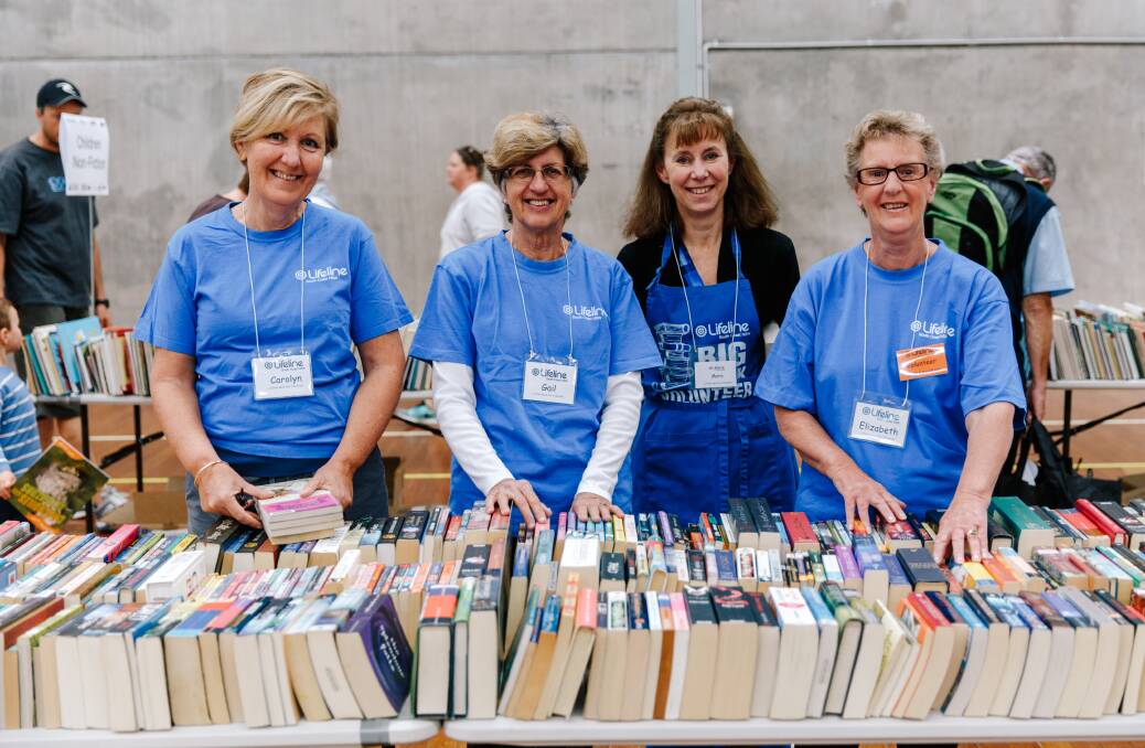 Lifeline volunteers: Many hands make light work of all the books to be sorted and placed into the correct categories at the Lifeline Big Book Fair.