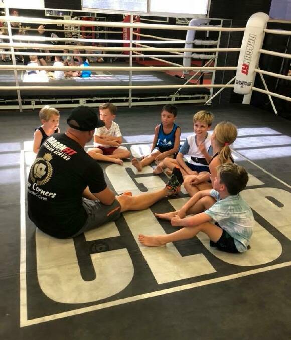 Classes for kids at Dragonfit too: Trainer Clayton Wall with the kids' boxing class. 