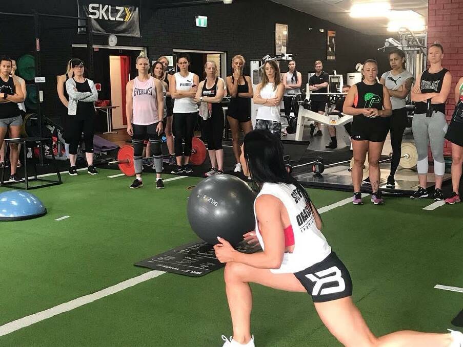 Professional staff: Trainer Suzy Blanch explaining each exercise during the booty blaster class at Dragonfit.