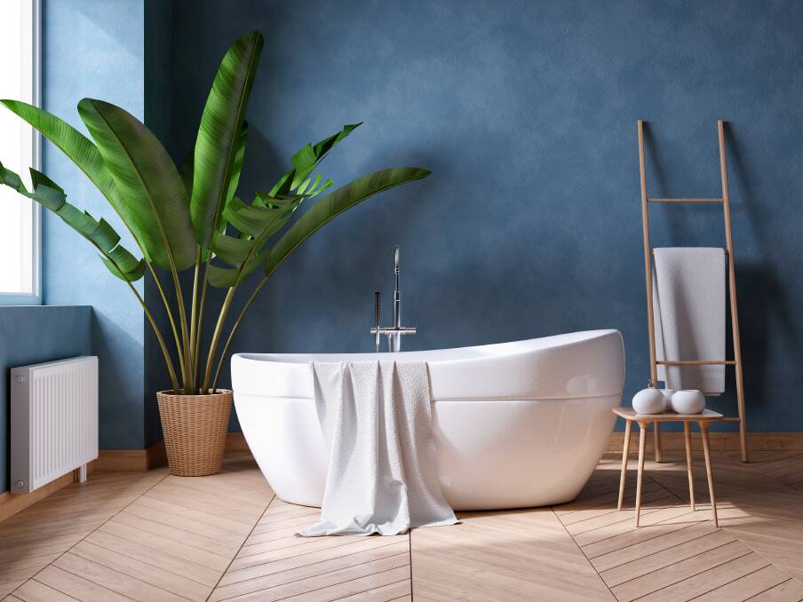 JAZZ IT UP: Complement your bathroom with plain coloured accessories, such as white towels, and a hint of greenery. Photos: Shutterstock
