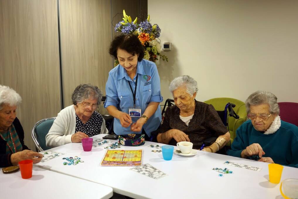 CONNECTION: Ana Maria Di Pietro and ITSOWEL clients enjoy some games at a Social Support Group in Woonona.