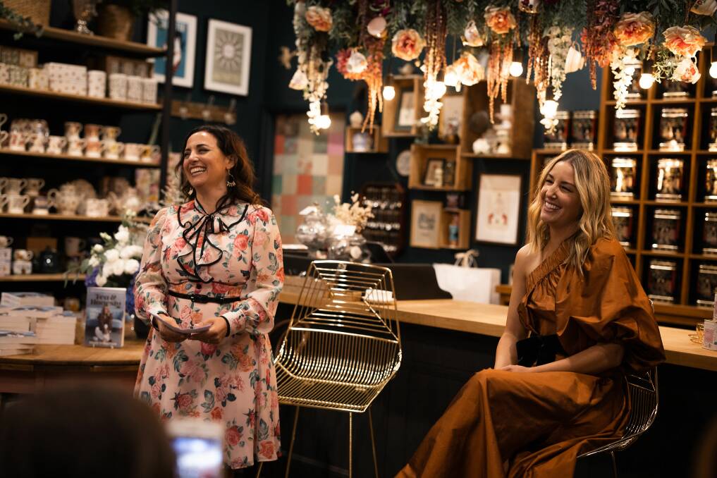 SWEET TREAT: Berry Tea Shop owner Paulina Collier with Jules Sebastian on Friday evening at the launch of her book, Tea & Honesty. Picture: Rachael Tagg Photography, rachaeltagg.com.au