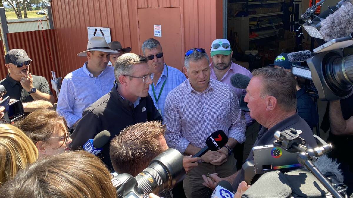 NSW Premier Dom Perrottet and Member for Orange Phil Donato talk to Eugowra local James Wilson after the devastation in the village. Picture by Philip Donato MP Facebook page.