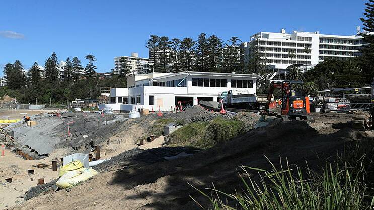 ACTIVITY GALORE: Work on the North Wollongong Surf Club is closing in on a finishing date.