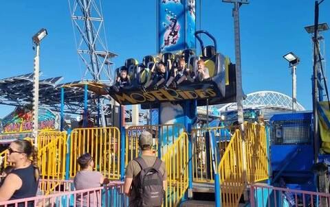 NO HARNESS: Four-year-old Tristan Curtis, far right, was photographed by an onlooker on the Easter Show's "Free Fall" ride on Sunday, Photo: Facebook