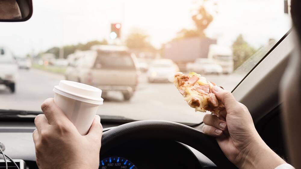 Eat and drive and risk three points and a three-figure fine. Photo: Shutterstock