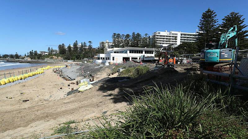 WORK CONTINUES: There's activity galore at North Wollongong Beach. Picture: Robert Peet.