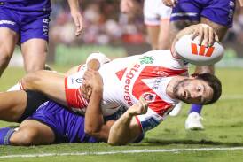 Dragon Ben Hunt gives his all on the way to the tryline at WIN Stadium. Picture by Adam McLean