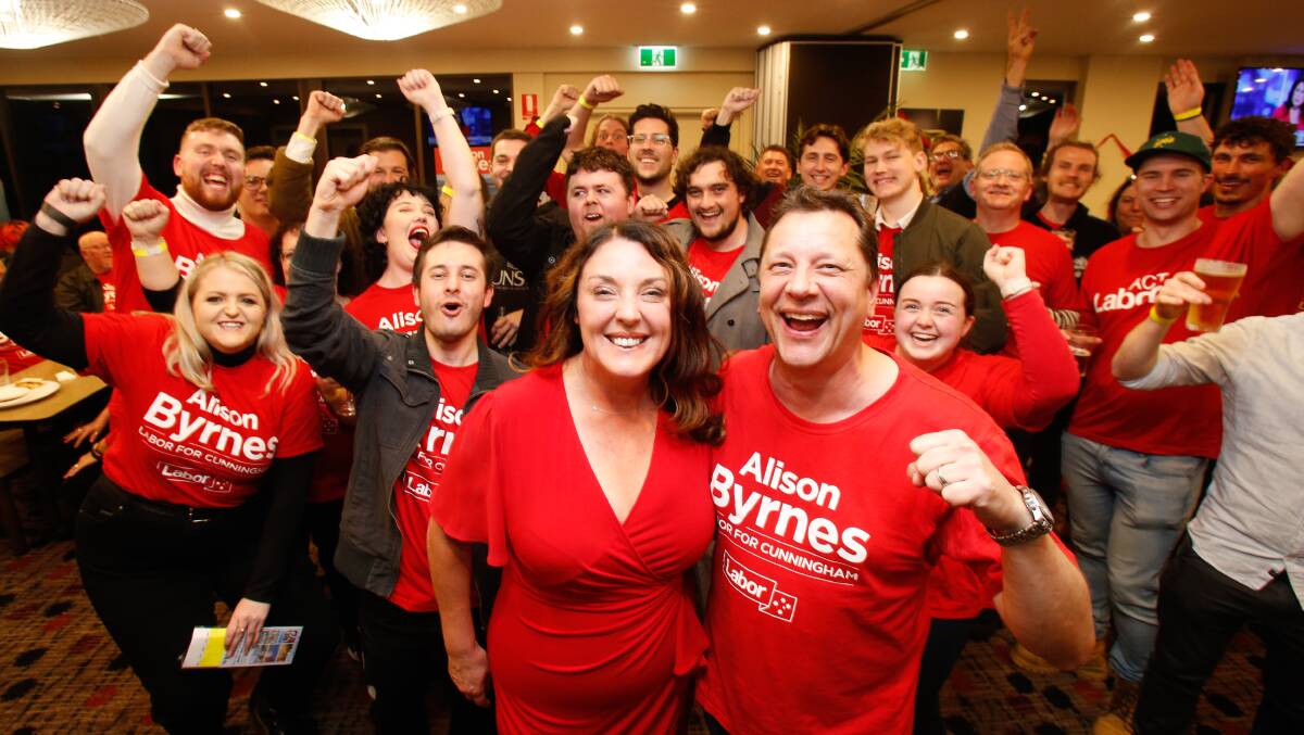 DOUBLE DELIGHT: Newly-crowned Cunningham MP Alison Byrnes with her husband, Member for Wollongong, Paul Scully and jubilant supporters on election night. Photo: Anna warr