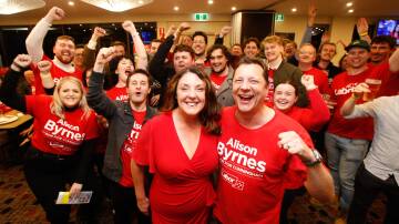 DOUBLE DELIGHT: Newly-crowned Cunningham MP Alison Byrnes with her husband, Member for Wollongong, Paul Scully and jubilant supporters on election night. Photo: Anna warr