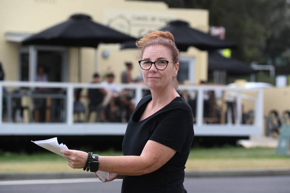 Rachel Weekes outside her Port Kembla cafe, Cakes By Rach, housing dozens of customers on Tuesday who are angry over Wollongong Council's attempt to close it down. Picture by Robert Peet.