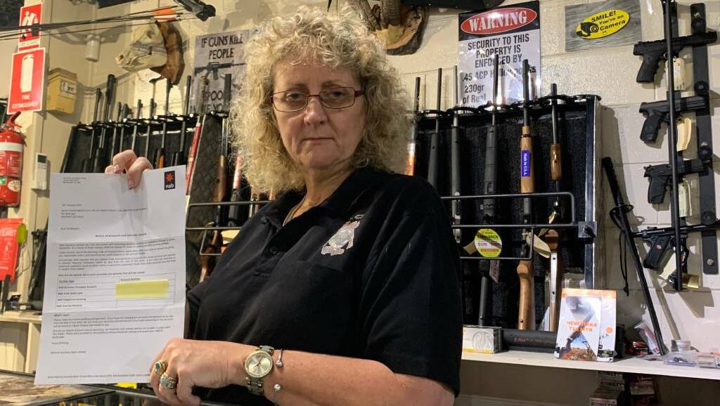  Smiffy's Guns & Ammo owner Anita Smith with the notification received from NAB.
