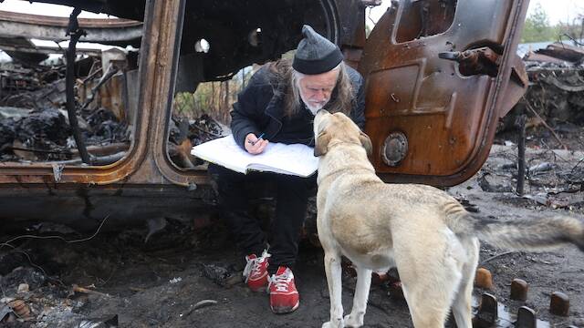 AN ADMIRER: George Gittoes in Ukraine. Picture: supplied