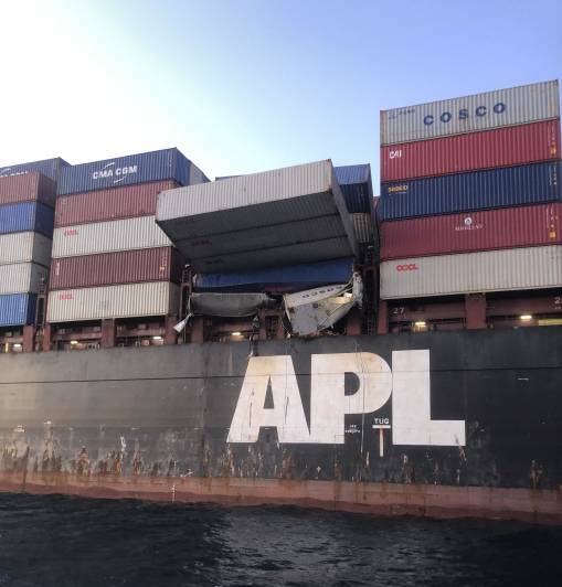 Containers hanging from the APL England on Tuesday. Pictures: AMSA