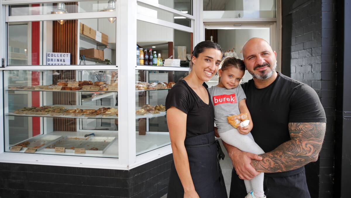 Carla Urosevski and partner Kaveh Akbari with daughter, Royaa Akbari, at Alexanders Cafe's second burek bakery in Corrimal. Picture by Adam McLean