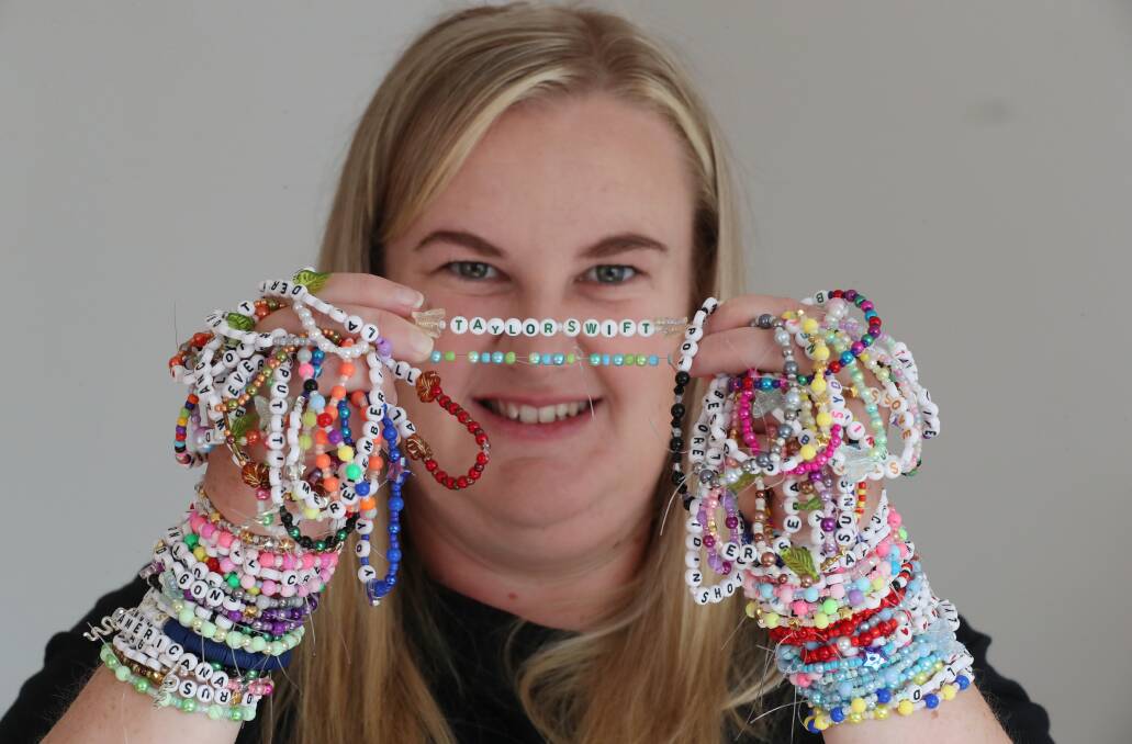 Ainsley Clarke with the bracelets she's looking to trade with other Swifties. Picture by Robert Peet