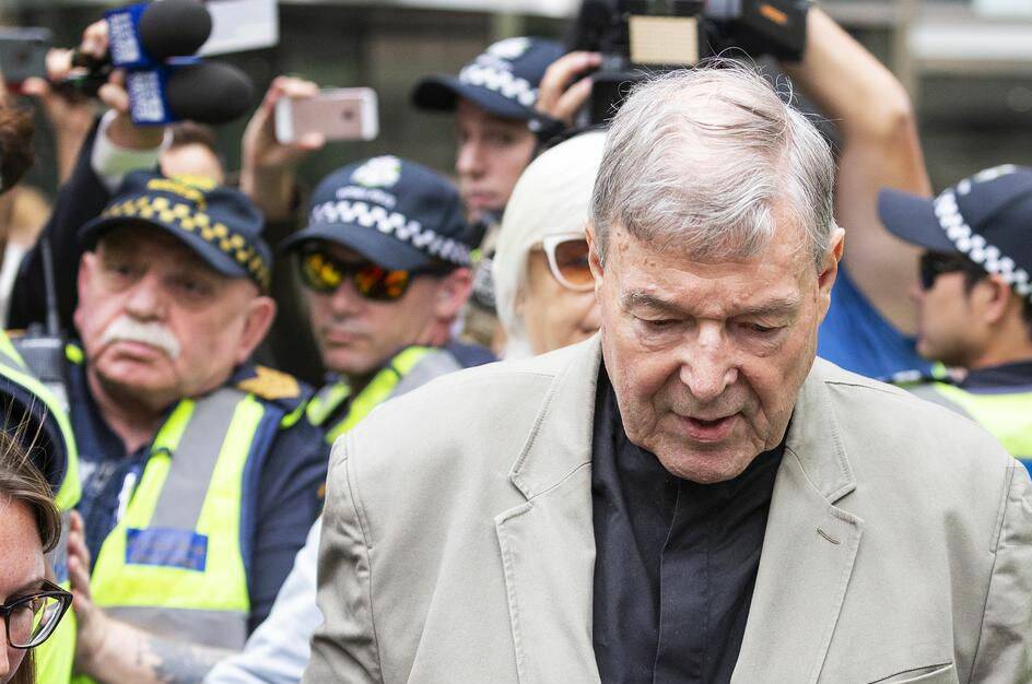 Cardinal George Pell leaves court.