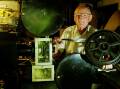 Ed Vormister, in 2004, with the film projector he made by hand in the 1940s It's now in the National Music and Sound Archive. Picture by Wayne Venables