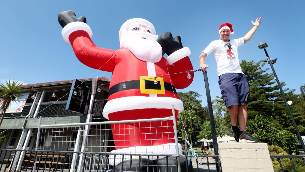 One carries with him the spirit of Wollongong's world-known Santa pub crawl. The other is a massive inflatable Santa. Brendon Ward offers tips on how to enjoy the day to the max. Picture by Sylvia Liber