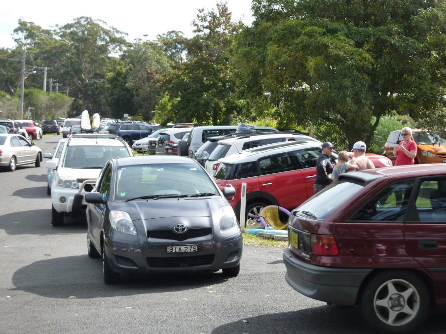 Cars trying to navigate narrow streets near Hyams Beach and parking anywhere they can over the peak season last year.
