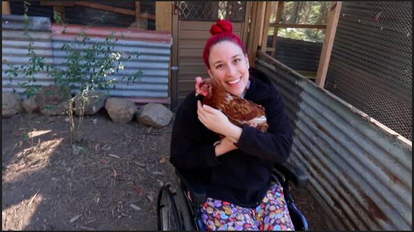 Nikki with on of her beloved rescue chickens. 