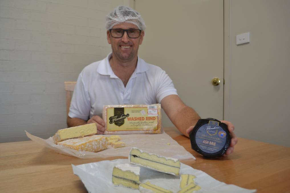 Unicorn Cheese production manager Graeme Bannister with award winning ash brie (front). Picture: Rebecca Fist.  