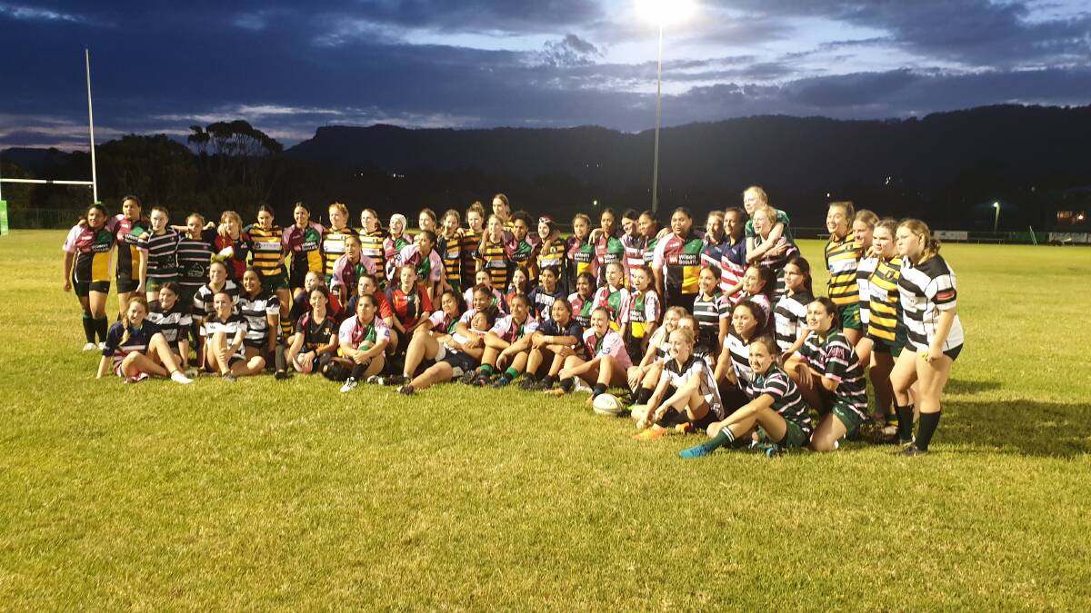 All smiles: The Illawarra girls rugby sevens players on Friday night. Picture: Wayne Cusack.