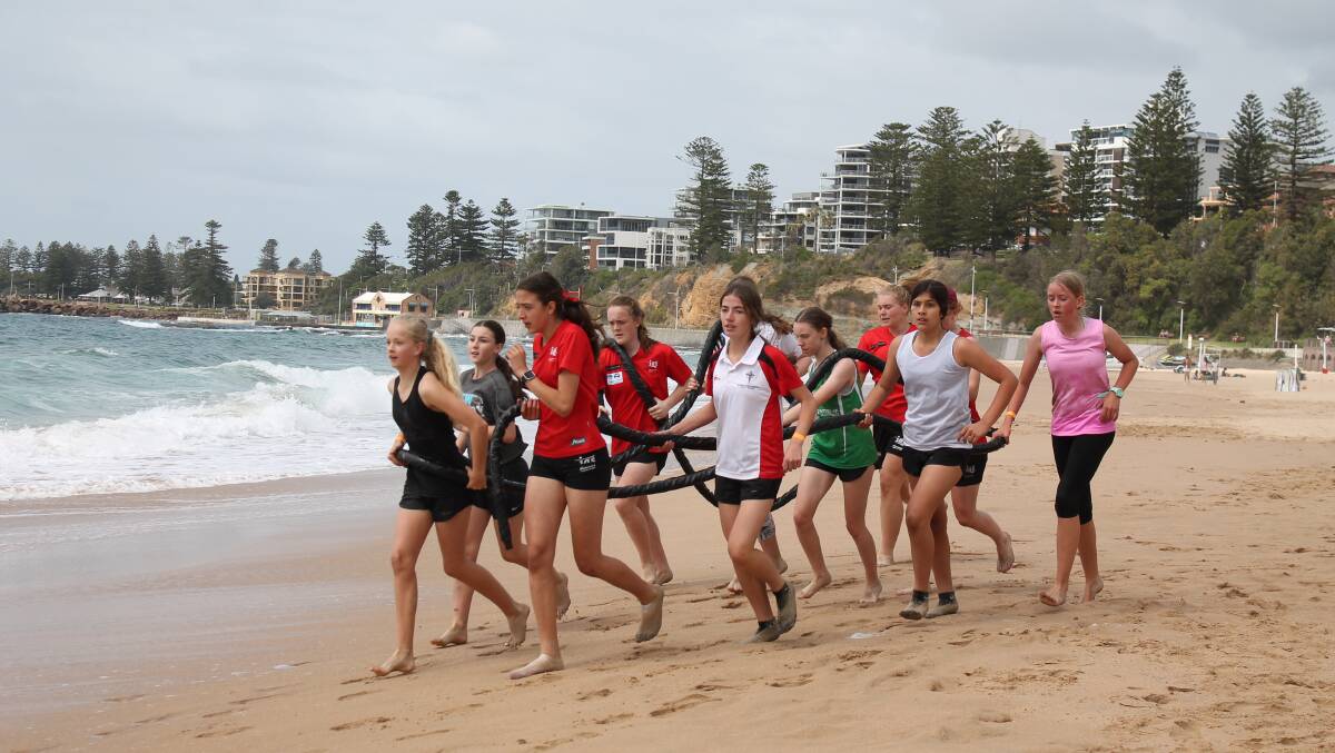 Team effort: Academy athletes carry a rope during Saturday's Survivor Day. Picture: Illawarra Academy of Sport.