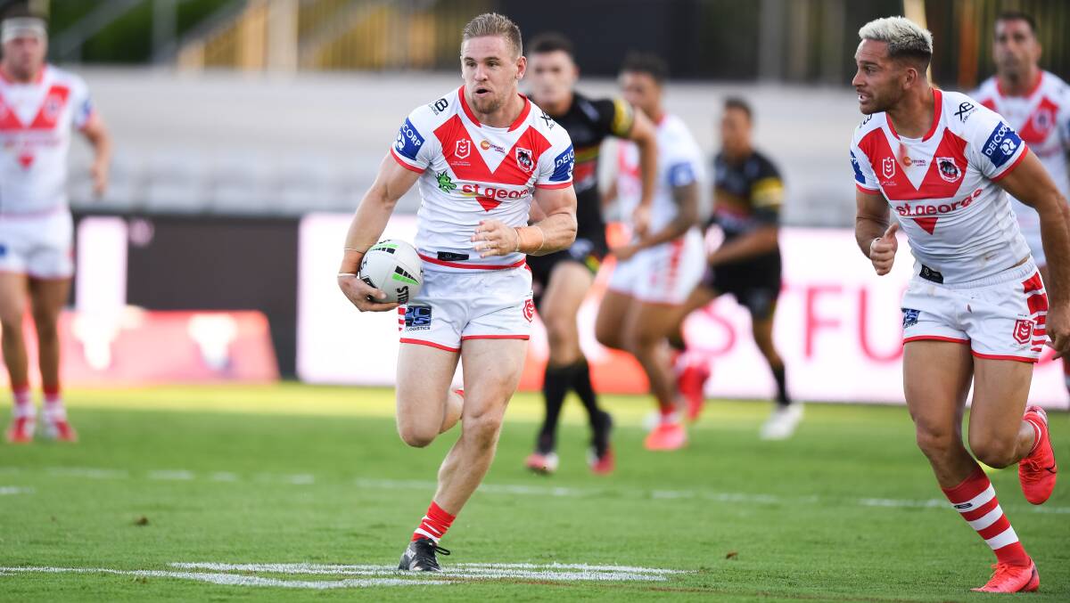 In full flight: Matt Dufty finds open space during the Dragons' round two loss to Penrith. Picture: NRL Imagery.