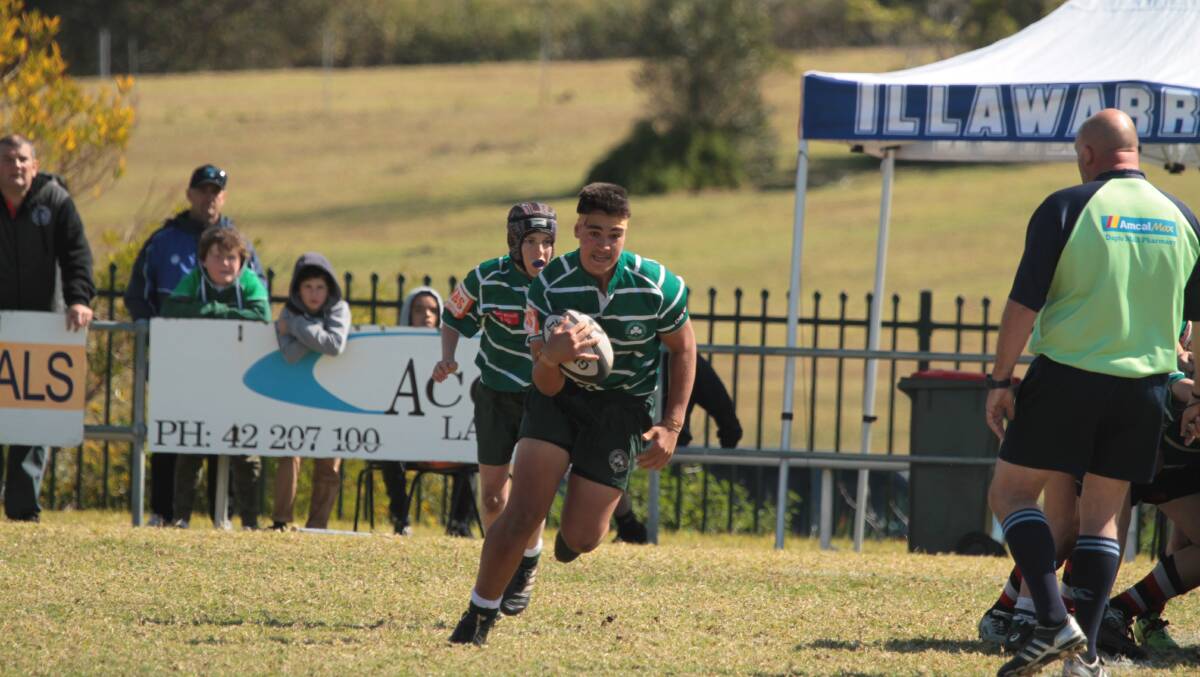 On the charge: Shamrocks under 13s forward Jai Duncan runs with the ball during his team's victory over Kiama on Sunday. Picture: Bruce Nugara. 