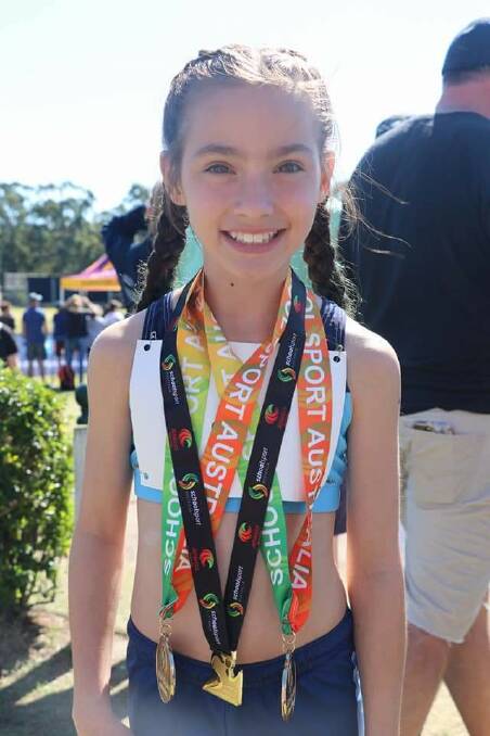 Triple gold: Oak Flats student Charlize Colwell. Picture: Crsytal Woll.