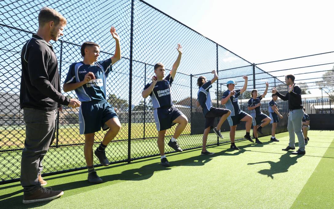 Mentors: Mitchell Hearn and Mitchell Calder run Illawarra Sports High students through a series of cricket drills. Picture: Adam McLean
