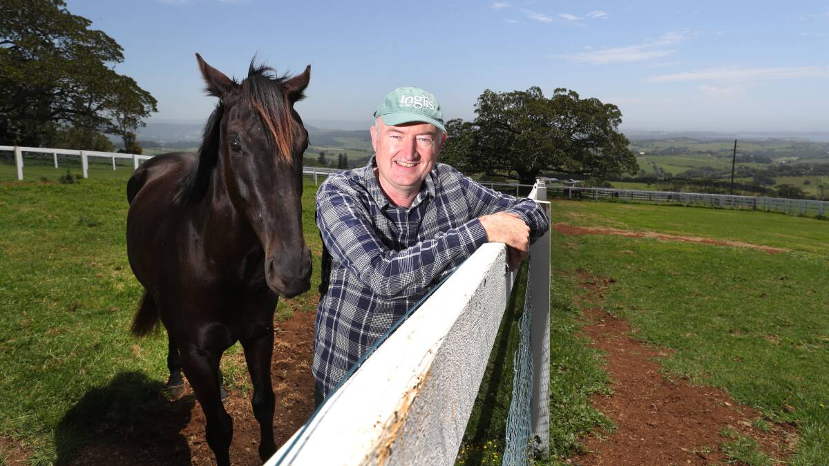 Bred for success: Matthew Sandblom with Spectrometer at his Kiama farm. The successful businessman owns a share of four horses in Saturday's Kembla Grange feature, the Group 3 Up and Coming Stakes. Picture: Robert Peet