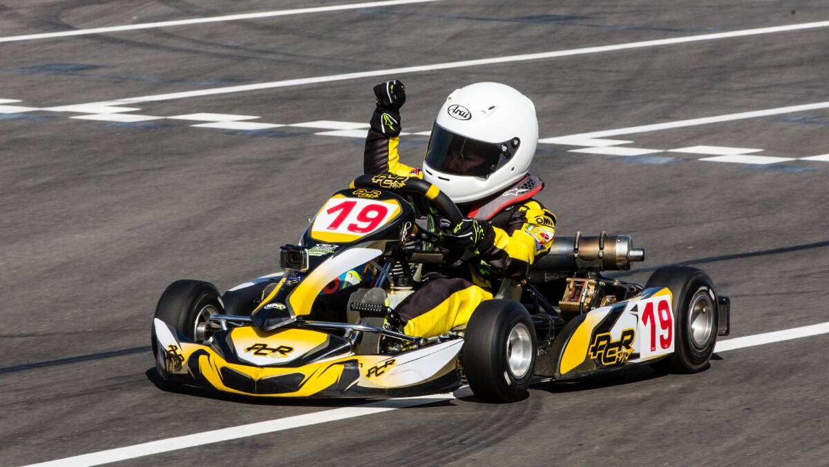 Out in front: Corey Carson celebrates his victory at the Karting Australia Ultimate Club Racer competition at The Bend in South Australia. Picture: Pace Images. 