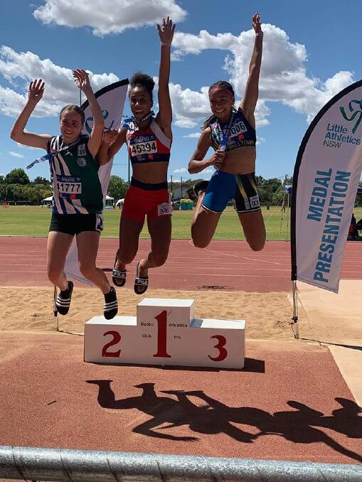 Winners are grinners: Chelsea Ezeoke (centre). Picture: APLAC.