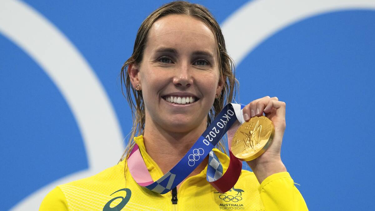 Golden smile: Emma McKeon celebrates yet another victory at the Tokyo Olympics. Picture: Gregory Bull/AP