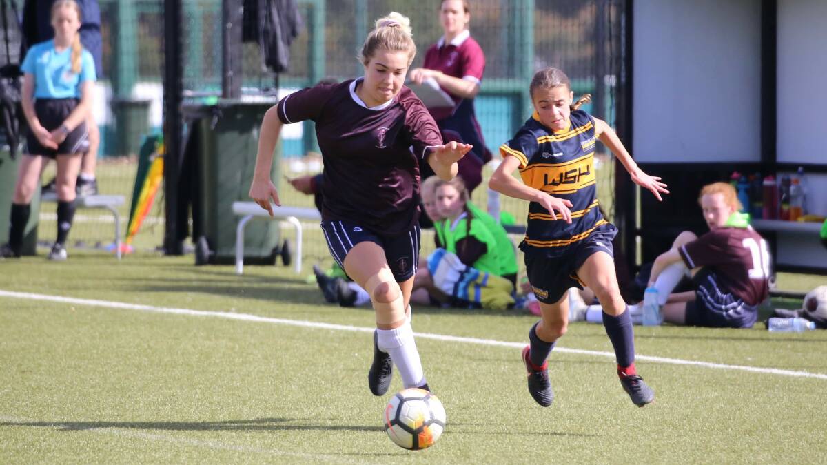 On the run: Narvana-Lee Holland charges down the sideline during the Bill Turner Trophy final. Picture: Bill Turner Football. 