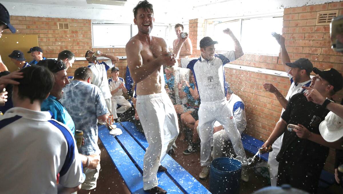 Let the party begin: University celebrate their grand final victory in the change rooms on Saturday afternoon. Picture: Adam McLean