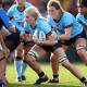 Driving forward: Albion Park teenager Ella Koster takes on the Force defence during her Waratahs debut last weekend. Picture: Mark Kolbe/Getty Images