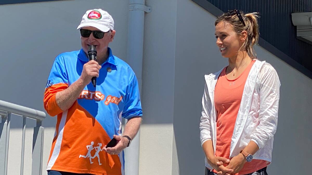 Thanks for the memories: Sally Fitzgibbons presented Ian Hatfield with Athletics NSW life membership on Saturday. Picture: Supplied