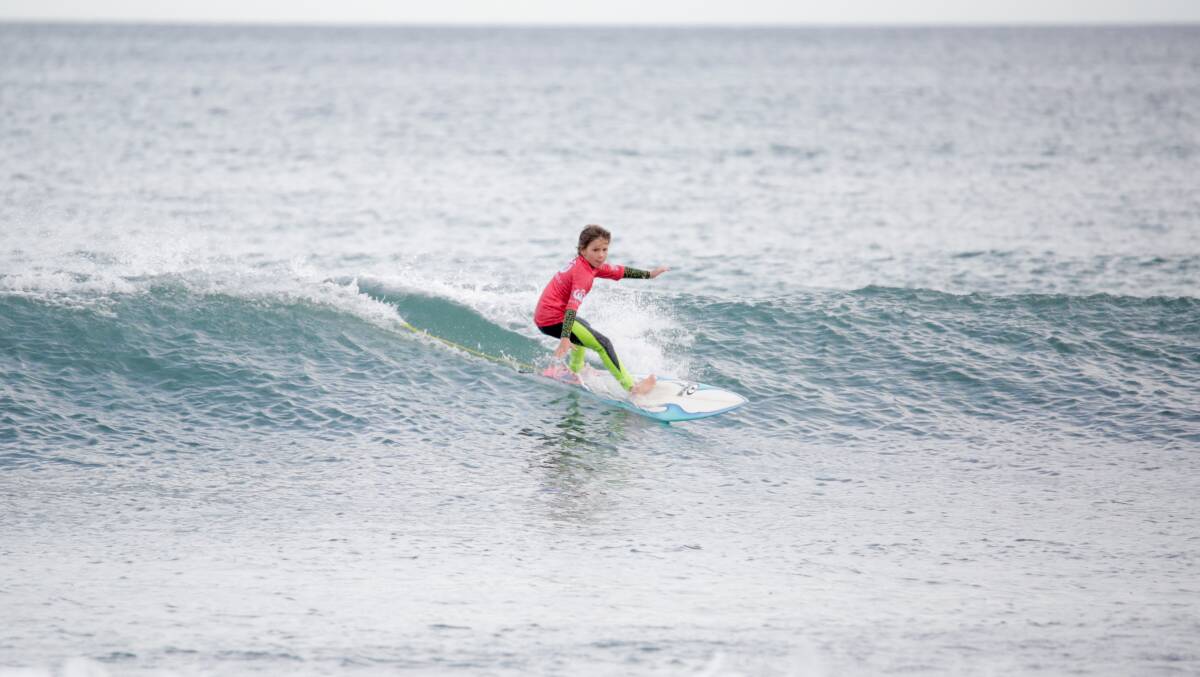 Riding high: Cruz Air was awarded the wave of the day award on Sunday at the Kiama Grom Surfer Series event. Picture: Nick Hollman/Surfing NSW.