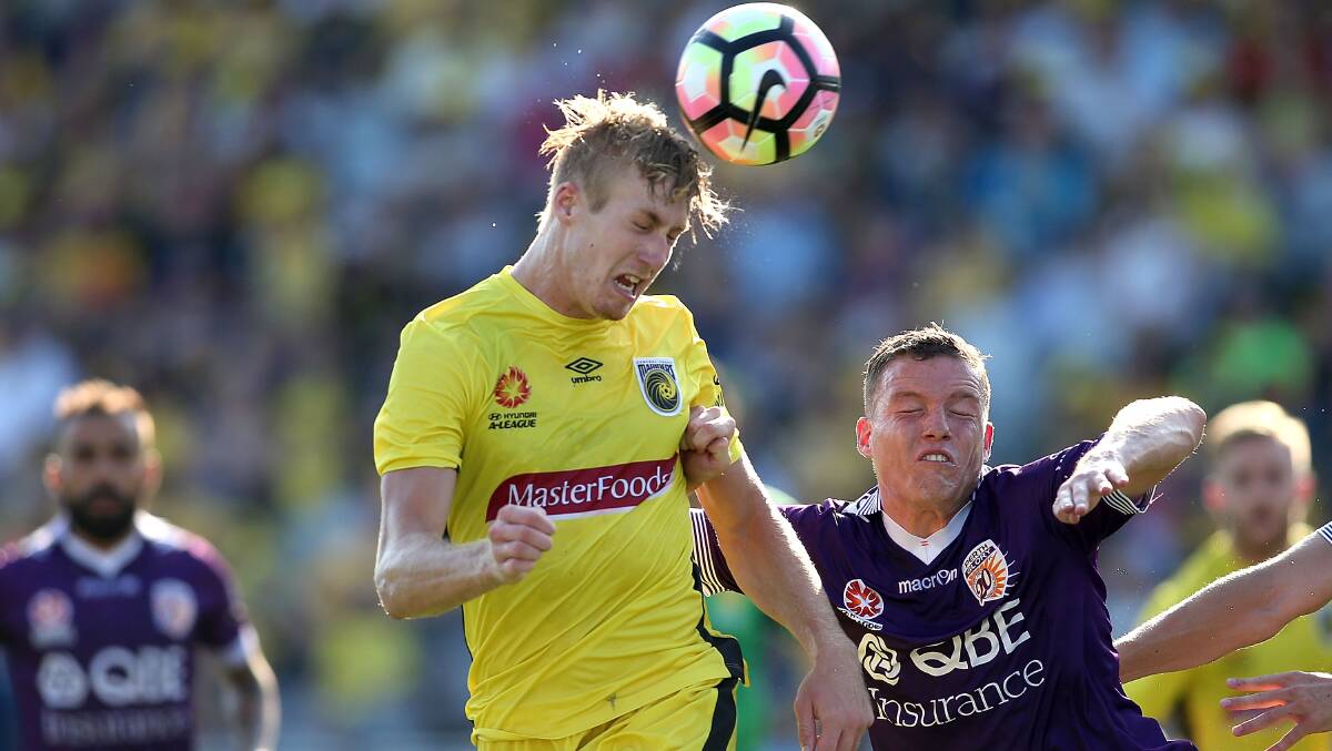 Aerial threat: Josh Bingham is looking to use this season with the Wolves as a platform to return to the A-League. Picture: Getty Images/Tony Feder.