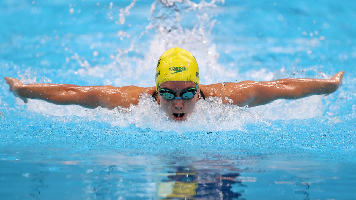 Flying into frame: Emma McKeon set an Australian record in her opening swim of the Tokyo Olympics. Picture: Clive Rose/Getty Images