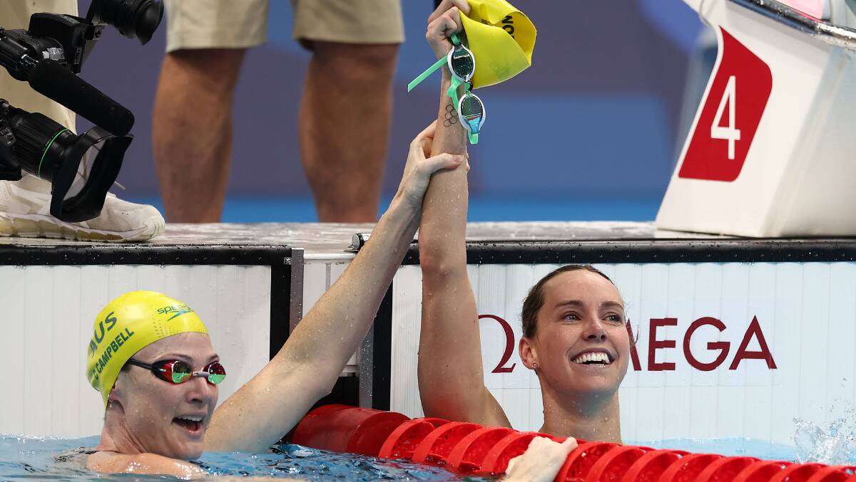 Olympic champion: Emma McKeon celebrates her 100m freestyle win with Australia's Cate Campbell. Picture: Clive Rose/Getty Images