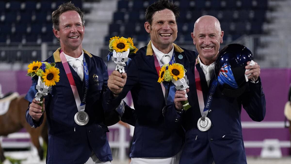 All smiles: Shane Rose (centre) Picture: Carolyn Kaster/AP